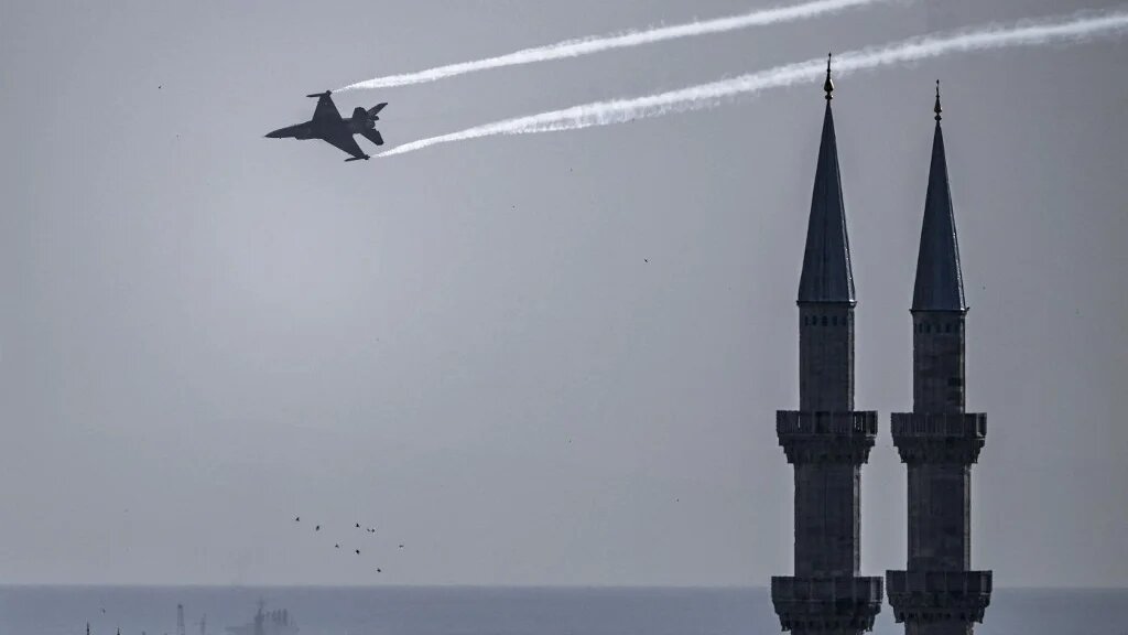 A Turkish Air Force (THK) aerobatic team performs a demonstration flight over Istanbul's Sultanahmet Mosque in Istanbul on 30 August 2024 (Kemal Aslan/AFP)