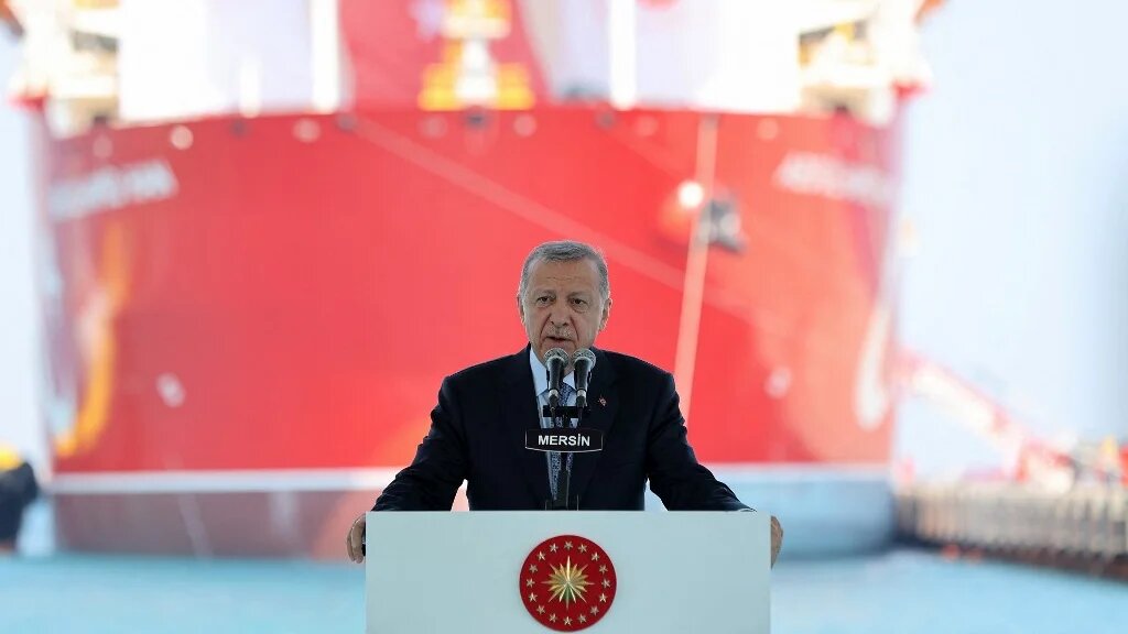 Turkish President Recep Tayyip Erdogan stands in front of the Abdulhamid Han drill ship, in Mersin, on 9 August 2022 before it was sent to the Mediterranean Sea for gas exploration (AFP)