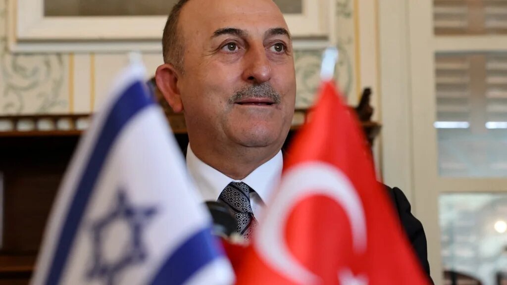 Turkish Foreign Minister Mevlut Cavusoglu gives an opening statement before meeting with Israeli and Turkish businessmen, in the coastral city of Tel Aviv, on May 25, 2022. (AFP)