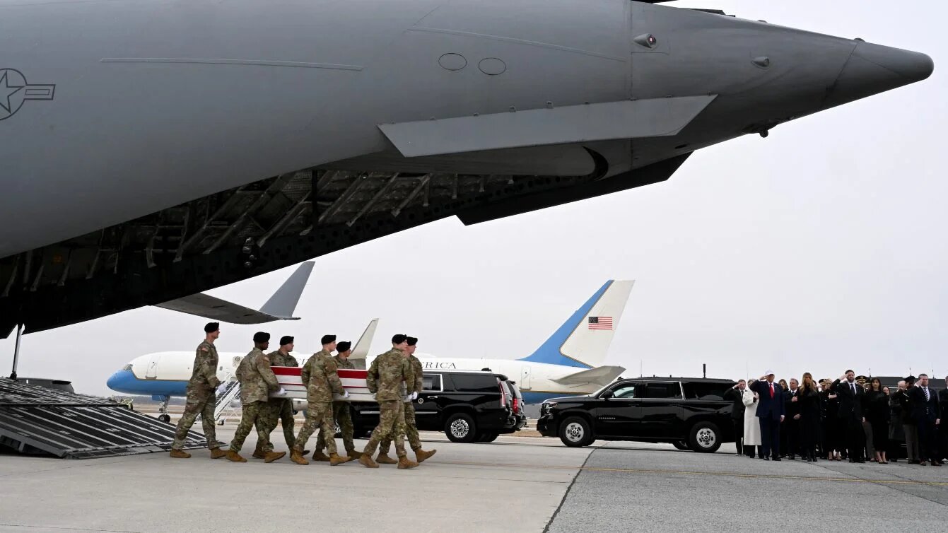 US President Donald Trump salutes as a US Army carry team transfers the body of Officer Robert Marzan at Dover Air Force Base in Delaware on 7 March 2026 (Roberto Schmidt/Getty Images via AFP)