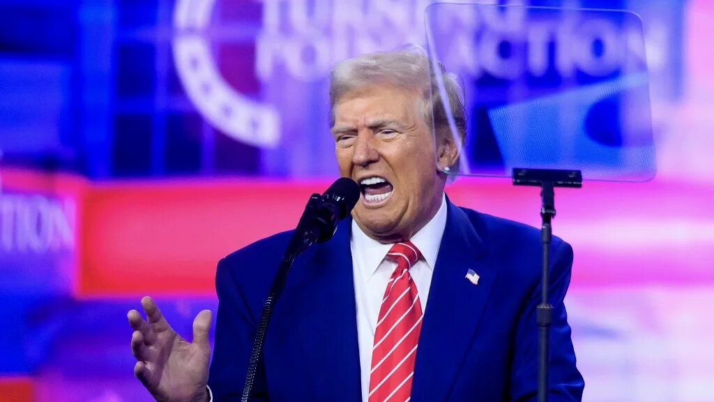 US President-elect Donald Trump speaks at the annual AmericaFest event in Phoenix, Arizona, on 22 December 2024 (Josh Edelson/AFP)