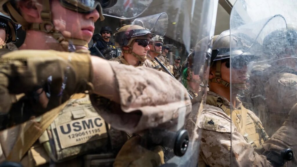 US Marines block protesters outside a federal building during an anti-Trump "No Kings Day" demonstration on 14 June 2025 in Los Angeles, California (AFP)