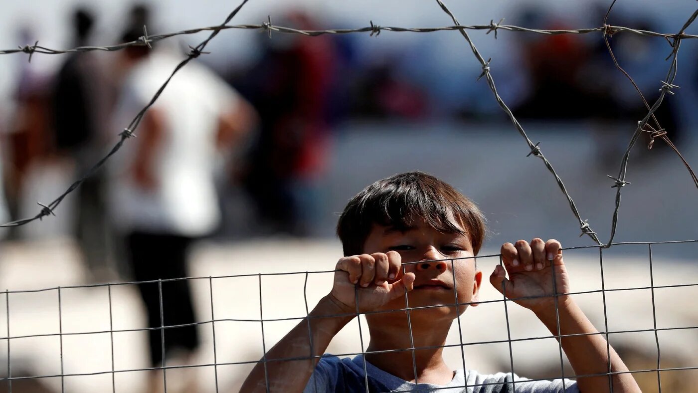 A child is seen at the new temporary camp for migrants and refugees on the Greek island Lesbos, 23 September 2020 (Reuters/Yara Nardi)