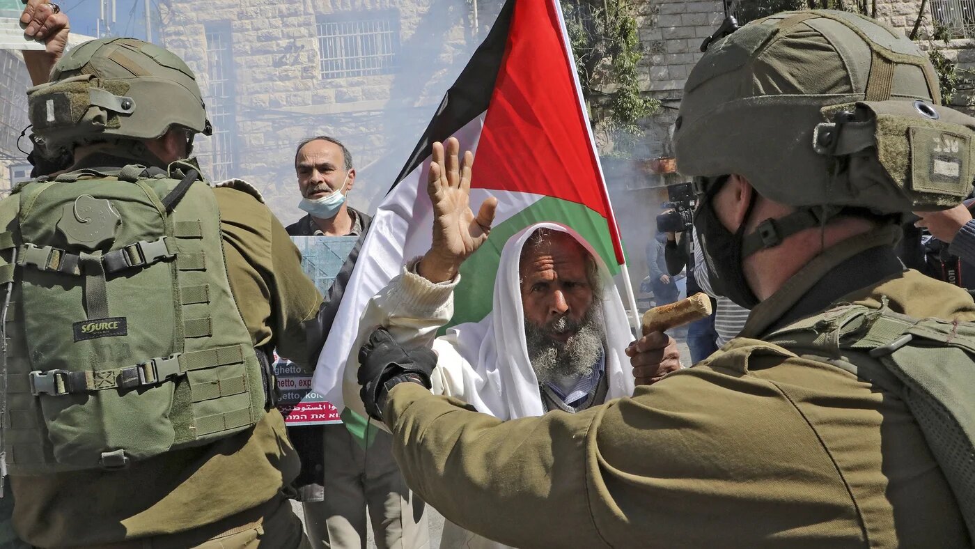 Israeli forces block Palestinian protesters during a demonstration 