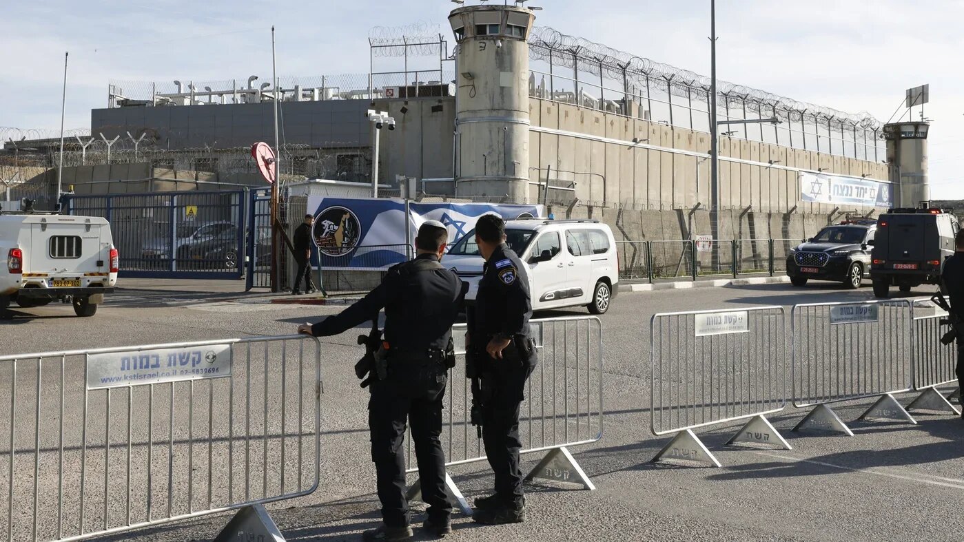 Israeli forces stand in front of the Ofer military prison in the occupied West Bank on 19 January 2025 (AFP/Jalaa Marey)