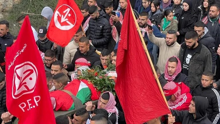 Mourners carry the body of Adam Essam Ayyad (Akram al-Waara)