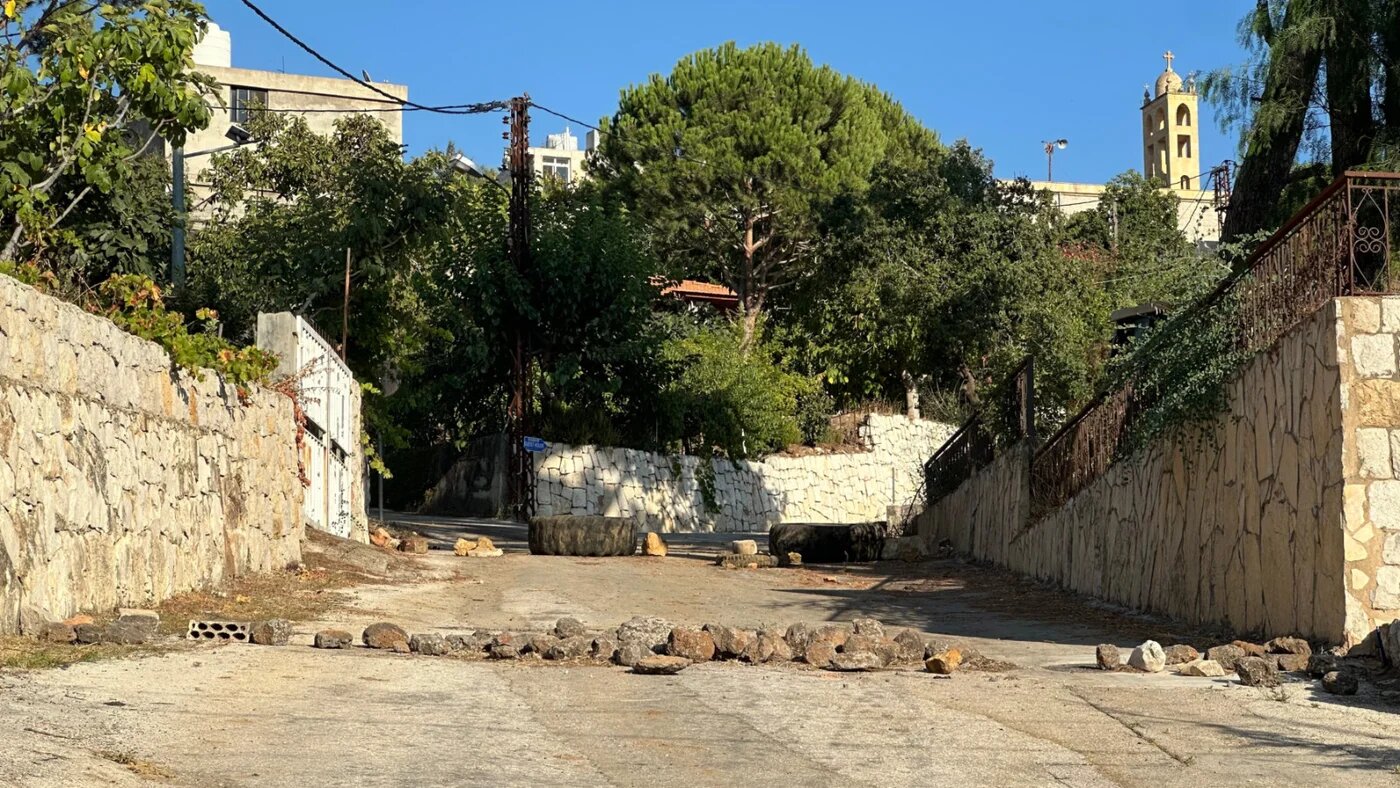Kfarchouba residents set up a makeshift barricade on the outskirts of their village to prevent the entry of 'outsiders' (Rogger Oliveira/MEE)