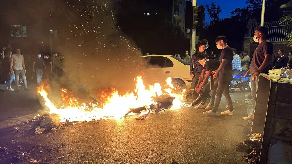 A protest in support of Mahsa Amini, who died after being arrested by Iran's 'morality police', Tehran, 19 September 2022 (AFP)