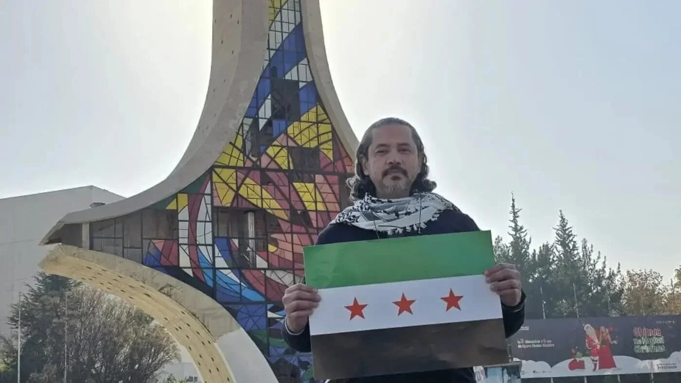 Abdul Rahman Yusuf al-Qaradawi, an Egyptian poet and activist, celebrates the fall of Syrian President Bashar al-Assad (X)