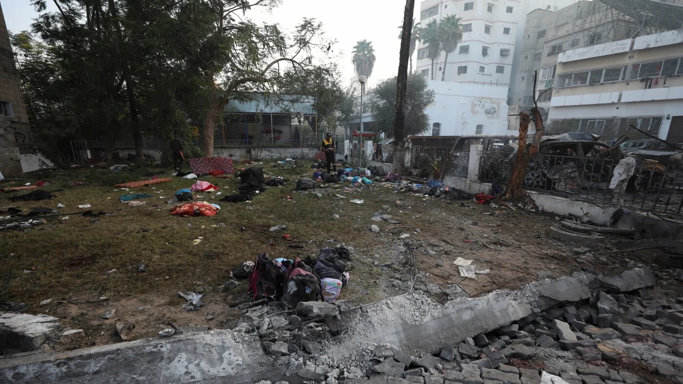 A man inspects the area of Al-Ahli hospital where hundreds of Palestinians were killed (Reuters)