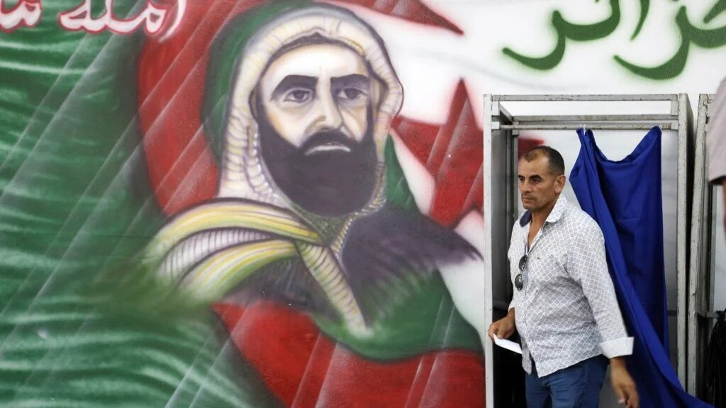 A man votes at a polling station in Algiers during parliamentary elections on 2 July 2026 (AFP)