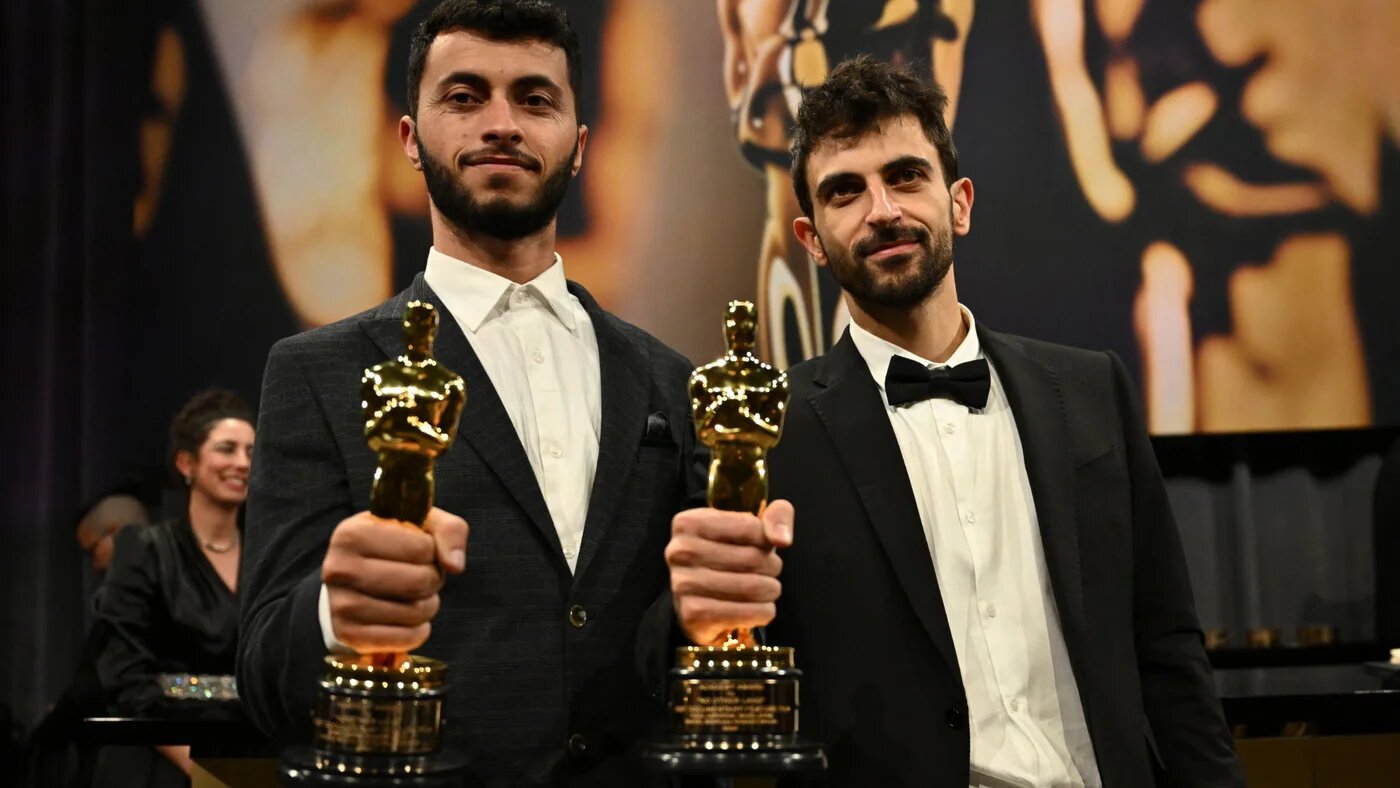 Basel Adra and Yuval Abraham attend the 97th Annual Academy Awards Governors Ball at the Dolby Theatre in Hollywood, California on 2 March 2025 (AFP)