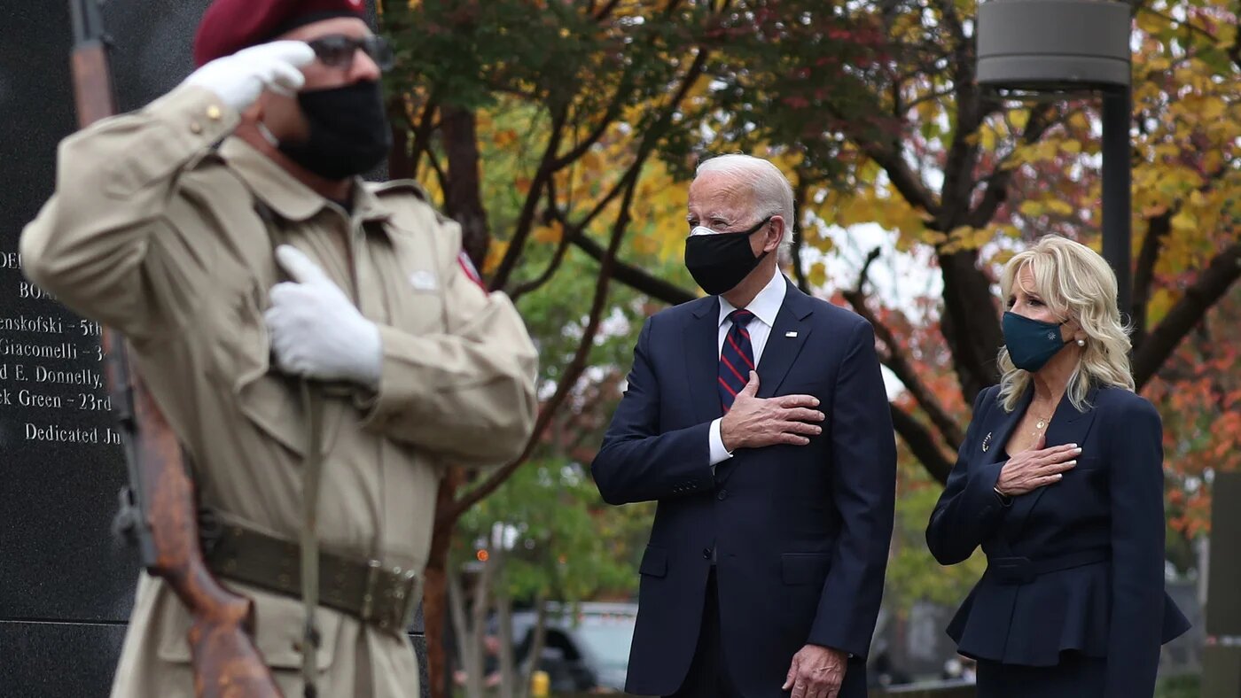 Joe Biden and his wife Jill pay respects during a Veterans Day stop at the Korean War Memorial Park in Philadelphia, Pennsylvania on 11 November.