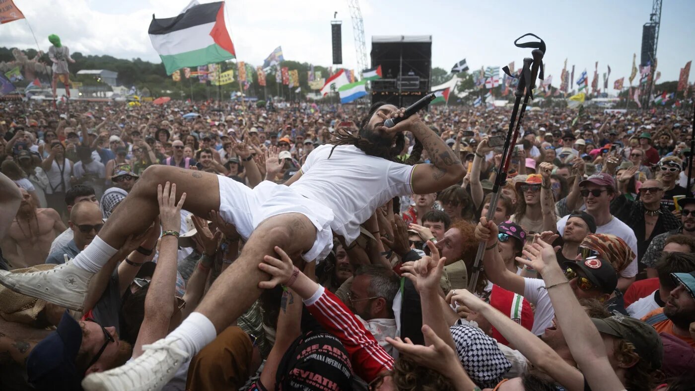 Bobby Vylan of the British duo Bob Vylan crowd surfs while performing on the West Holts Stage at Glastonbury Festival on 28 June 2025 (AFP/Oli Scarff)