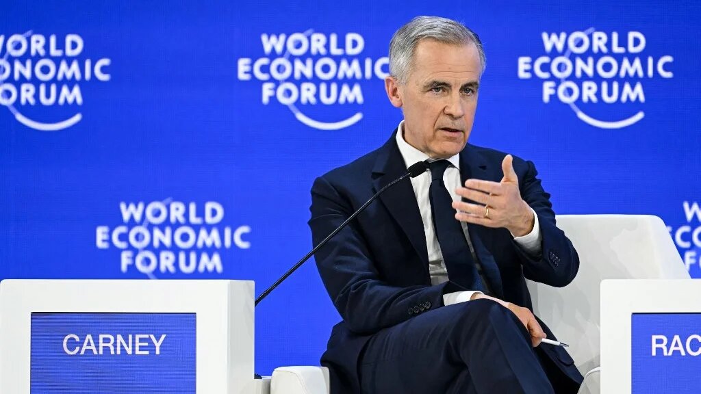 Canadian Prime Minister Mark Carney speaks at the World Economic Forum in Davos, Switzerland, on 20 January 2026 (Fabrice Coffrini/AFP)