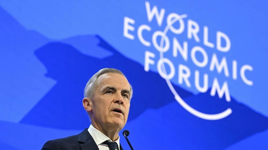 Canadian Prime Minister Mark Carney speaks at the World Economic Forum in Davos on 20 January 2026 (Fabrice Coffrini/AFP)