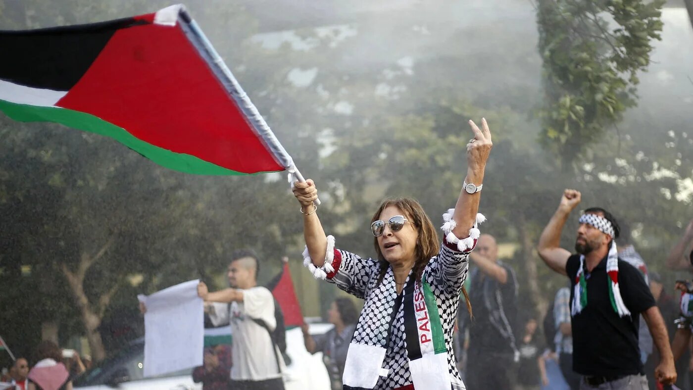 Chilean supporters of Palestine clash with the police during a protest against US President Donald Trump's recognition of Jerusalem as the capital of Israel in Santiago on 11 December, 2017 (AFP)