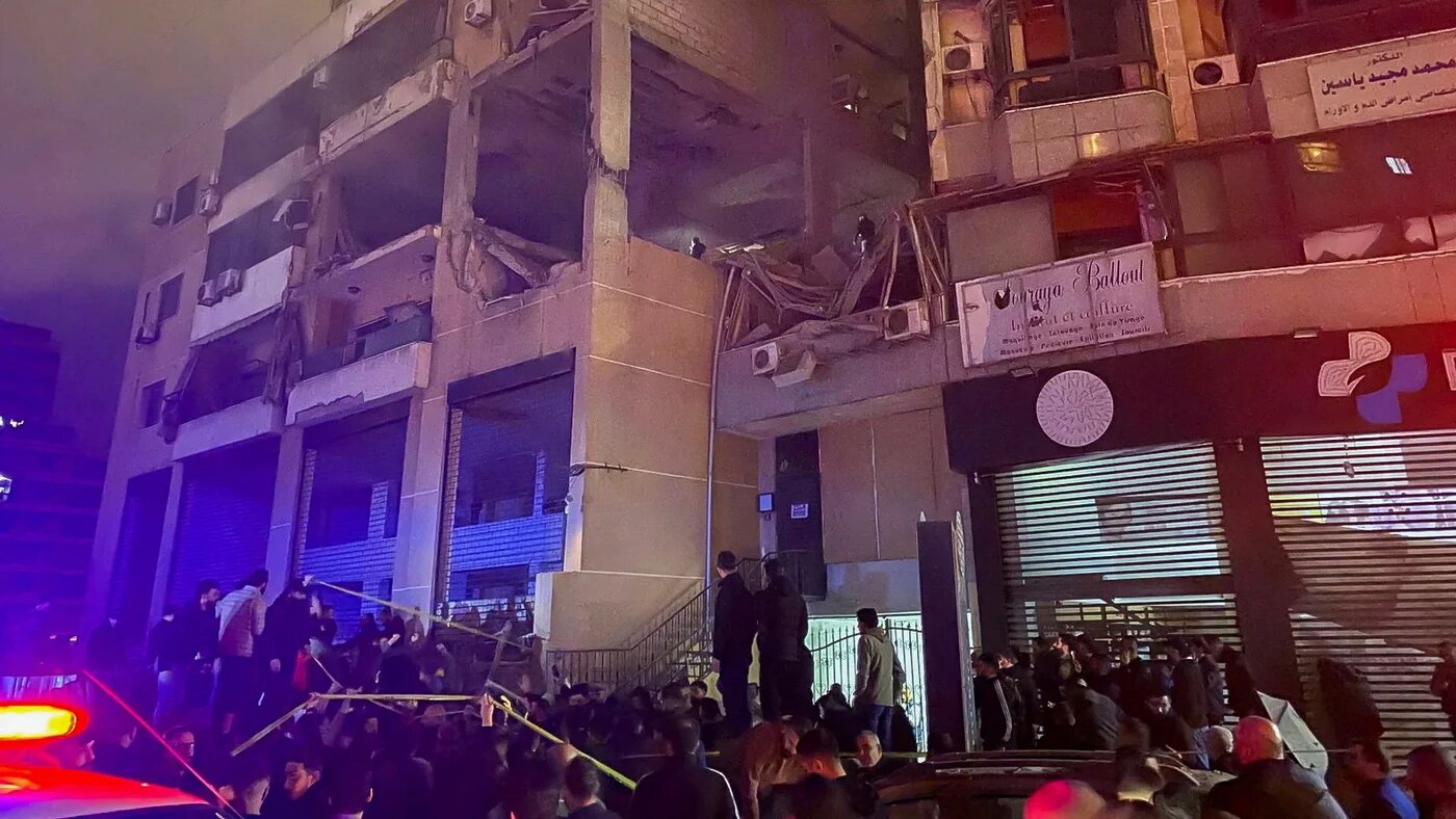 people gather near site of dahieh blast