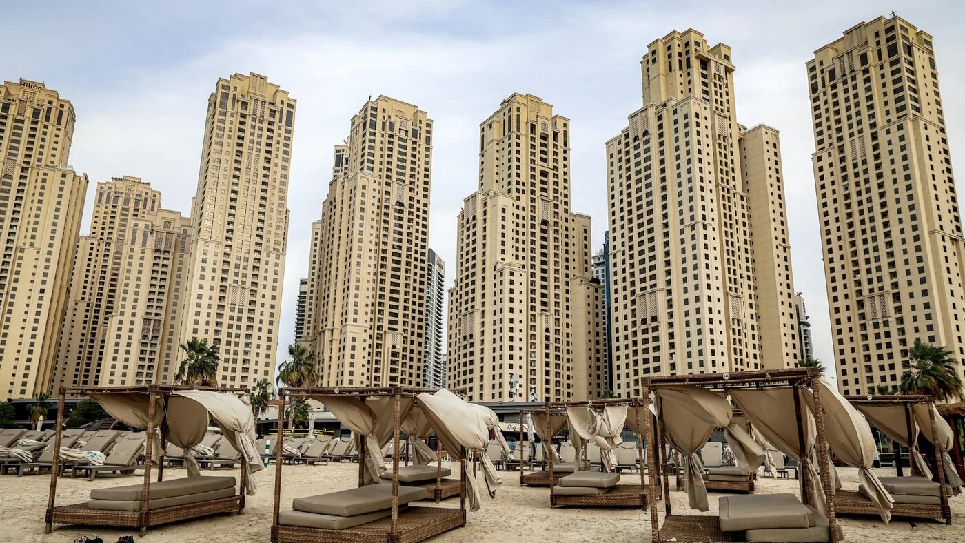 Empty beds are pictured before high-rise buildings along a beach at Jumeirah Beach Residence (JBR) in Dubai on 11 March 2026 (Fadel Senna/AFP)