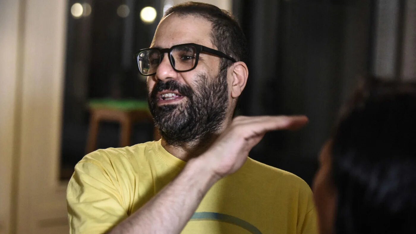 Egyptian-British activist Alaa Abd el-Fattah photographed at home in Cairo after his release on 23 September 2025 (AFP)