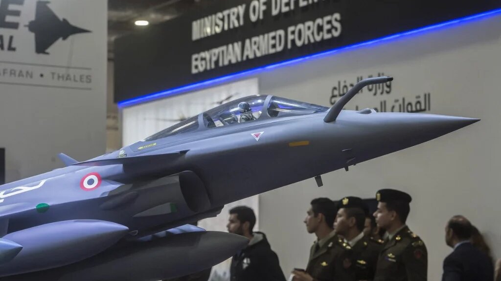 A model of the French made Rafale jet fighter is displayed during Egypt’s first Service Defence Exhibition in Cairo on 3 December 2018, at the International Exhibition Center (AFP)