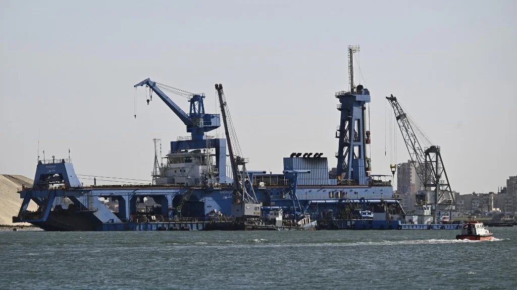 A ship moves through Egypt’s Suez Canal on 16 April 2025 (Khaled Desouki/AFP)