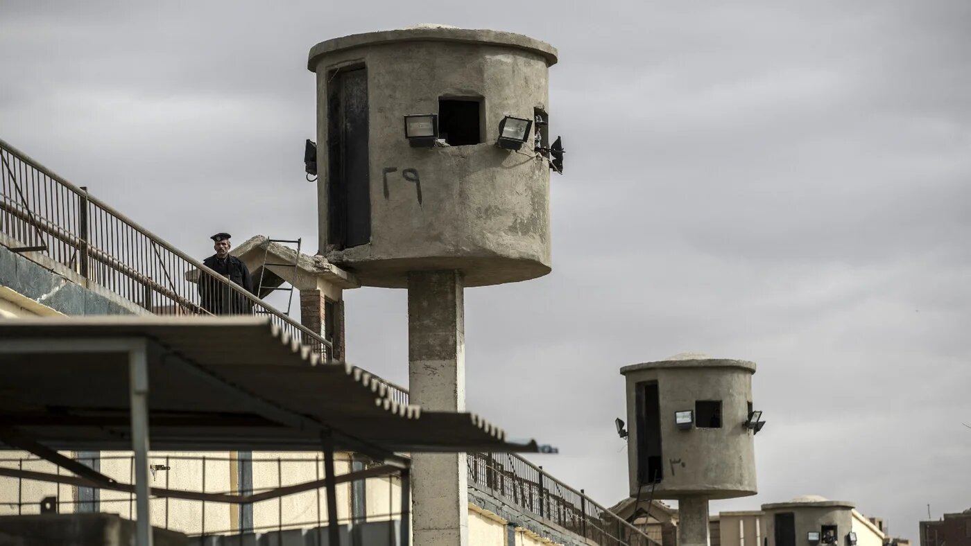 An Egyptian policeman near watch towers at Tora prison on the southern outskirts of the Egyptian capital Cairo on 11 February 2020.