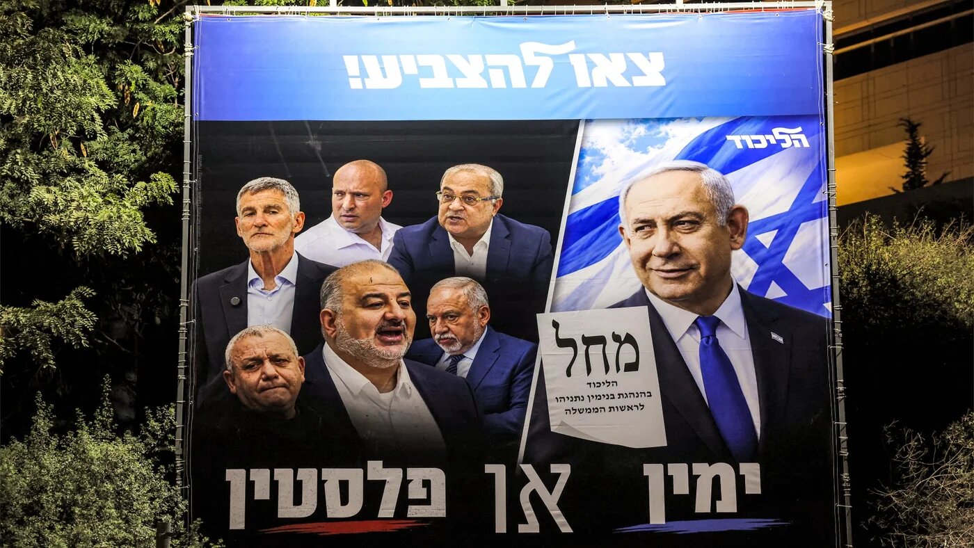 An electoral billboard for Israeli Prime Minister Benjamin Netanyahu's Likud party, with the Hebrew phrase "the Right or Palestine", is displayed in the predominantly-Arab city of Kafr Qasim in central Israel on 19 October 2026 (Ahmad Gharabli/AFP) 