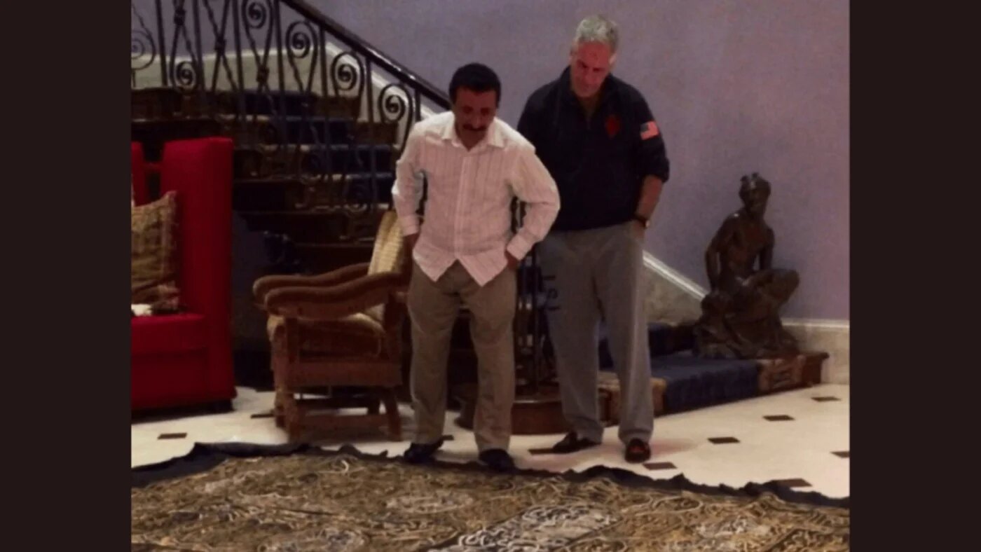Sex offender Jeffrey Epstein and Emirati businessman Sultan Ahmed bin Sulayem look at what appears to be a sacred cloth from Mecca in Saudi Arabia (US Department of Justice)