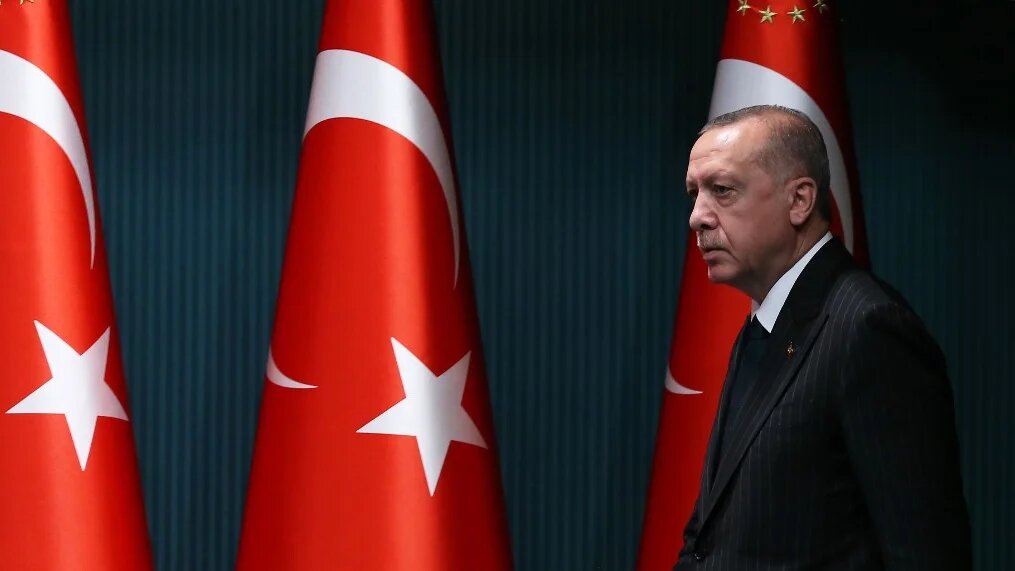 President Recep Tayyip Erdogan arrives for a news conference in Ankara