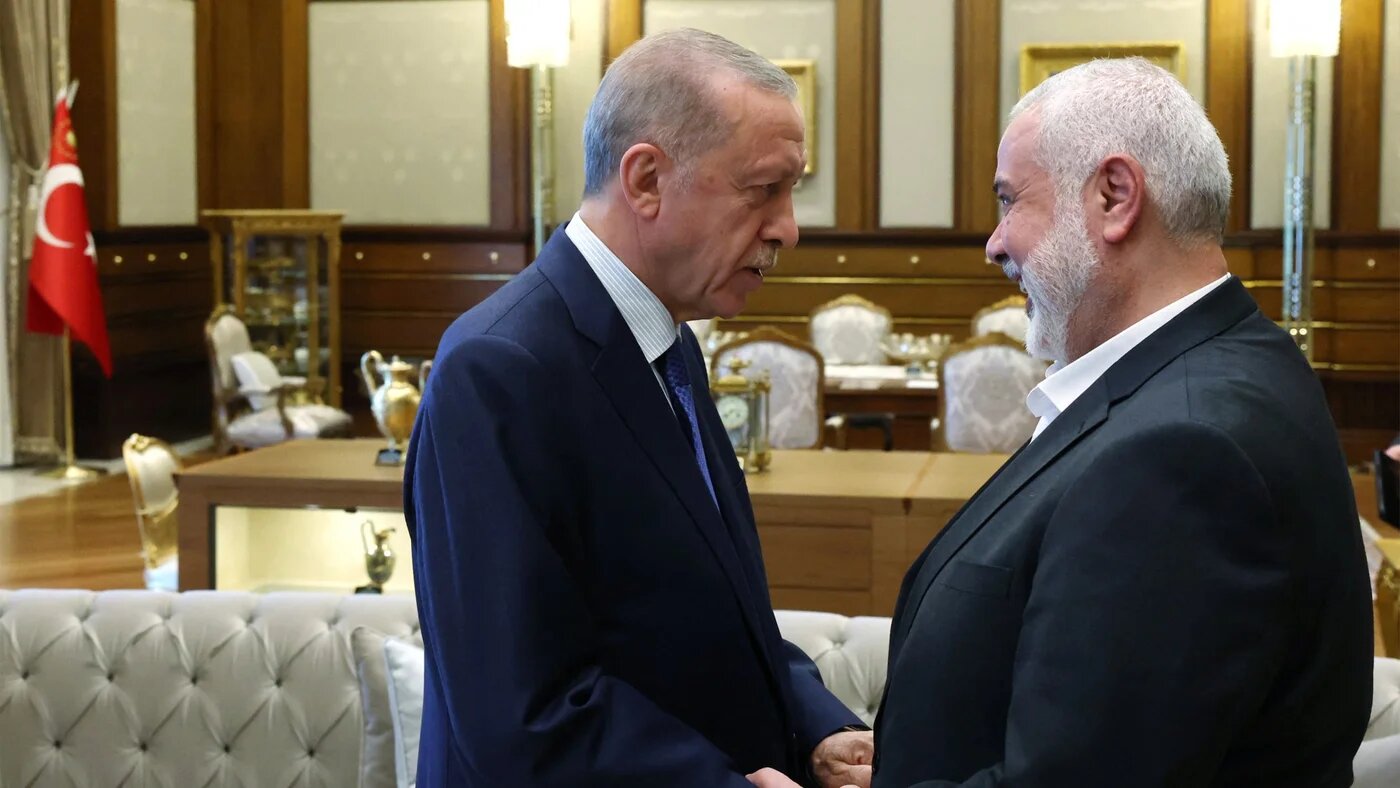 Turkish President Recep Tayyip Erdogan welcoming Ismail Haniyeh at the Presidential Complex in Ankara (Mustafa Kamaci/Turkish Presidency Press Office/AFP)