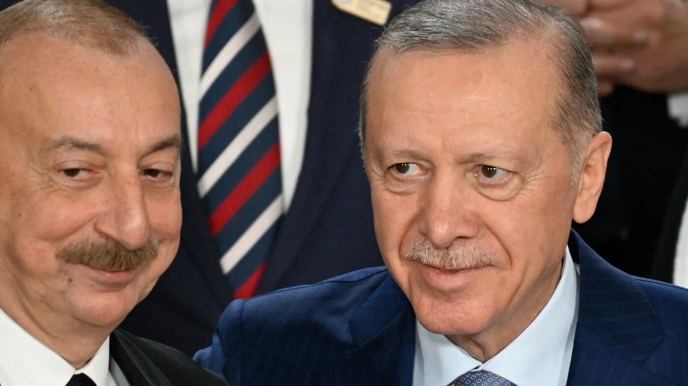 Azerbaijan's President Ilham Aliyev and Turkey's President Recep Tayyip Erdogan pose for a family photo during the United Nations Climate Change Conference (COP29) in Baku on November 12, 2024. Alexander NEMENOV / AFP
