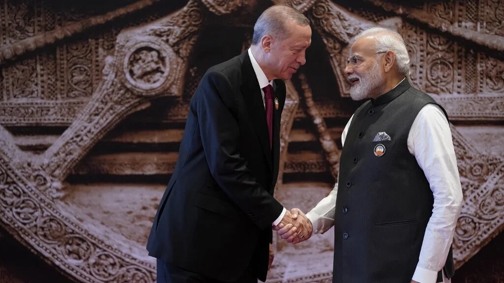 India's Prime Minister Narendra Modi shakes hands with Turkey's President Recep Tayyip Erdogan ahead of the G20 Leaders' Summit in New Delhi on 9 September 2023
