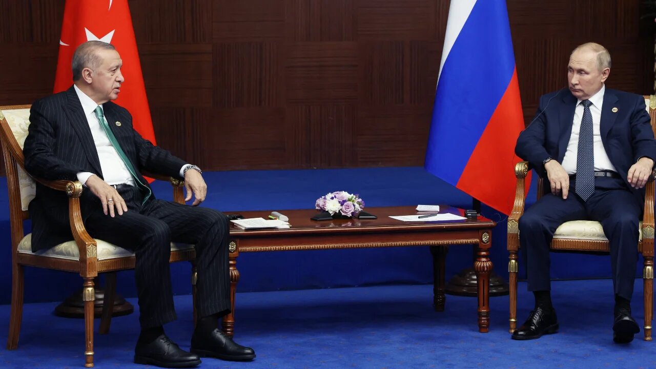 The Kremlin said Erdogan, left, and Putin, right, did not discuss ways to resolve the conflict in Ukraine during their meeting in Kazakhstan (AFP)