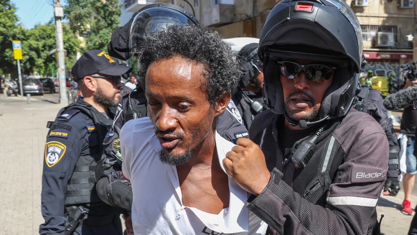 Members of Israel's security forces detain Eritrean asylum-seekers protesting an event organised by Eritrea's government in the coastal city of Tel Aviv on September 2, 2023. A dozen Eritrean asylum seekers were wounded by Israeli police gunfire on Sptember 2 after a demonstration against an Eritrean government event turned violent, police and medical sources said. JACK GUEZ / AFP
