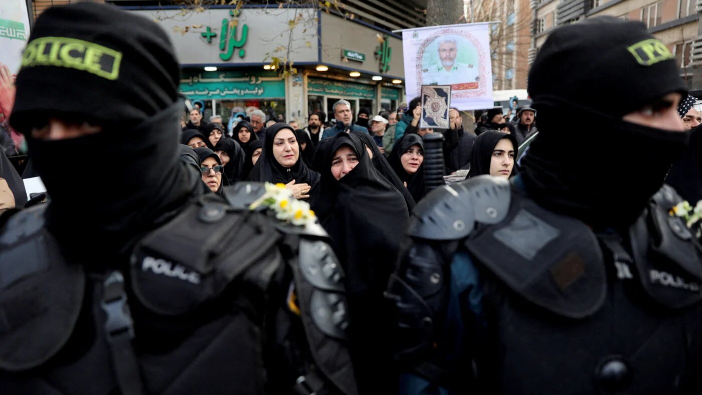 People attend the funeral of the security forces who were killed in the protests that erupted over the collapse of the currency's value in Tehran, Iran, 14 January, 2026. (Majid Asgaripour/WANA via Reuters)