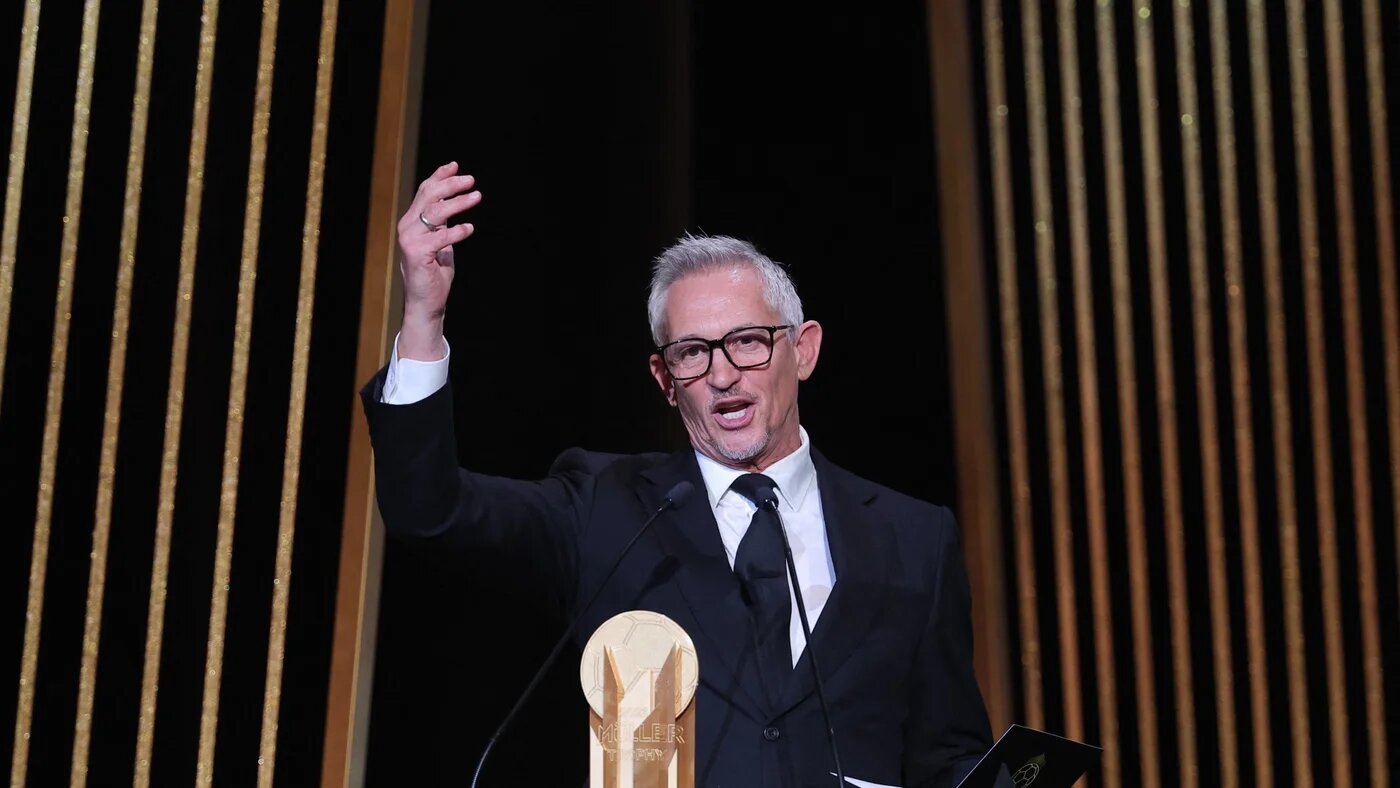 Gary Lineker, former England footballer turned sports TV presenter, gestures on stage with the Gerd Muller Trophy for best striker during the 2023 Ballon d'Or France Football award ceremony at the Theatre du Chatelet in Paris on October 30, 2023. FRANCK FIFE / AFP