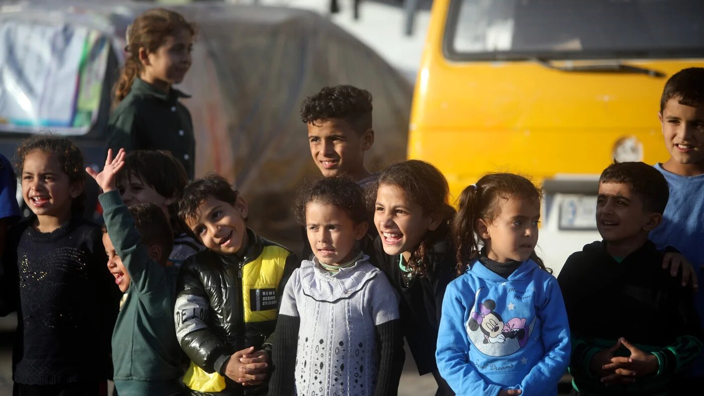 Displaced Palestinian children sheltering at a UN school, attend an entertainment performance in Rafah refugee camp, southern Gaza Strip, Thursday, Nov. 23, 2023. (AP Photo/Mohammed Dahman)