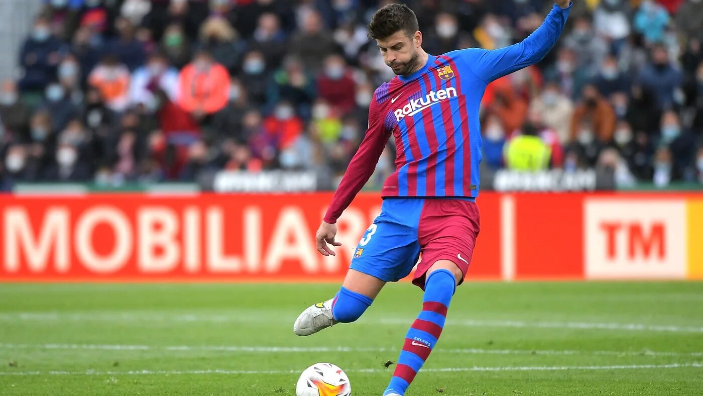 Barcelona's Gerard Pique kicks the ball during a match between Elche CF and FC Barcelona on 6 March 2022 (AFP/File photo)