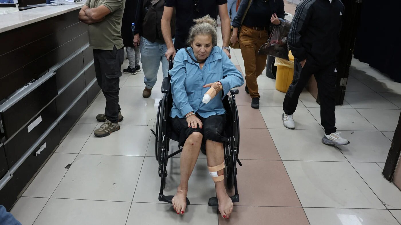 US photojournalist Heidi Levine leaves the emergency department of a government hospital in Ramallah, in the occupied West Bank, after being beaten by Israeli settlers while photographing Palestinian farmers harvesting olives in the village of Abu Falah on 16 October 2026 (AFP).