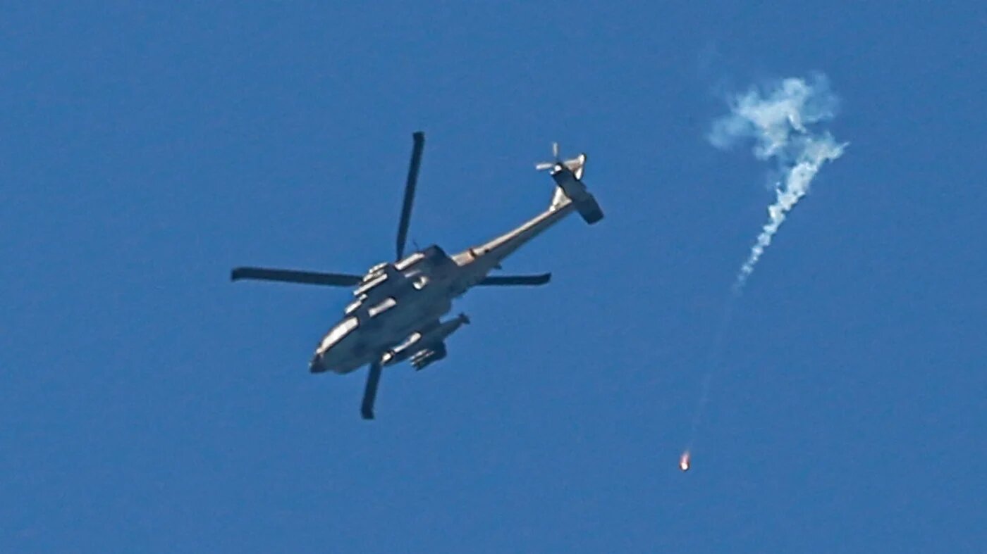 An Israeli helicopter fires flares over central Gaza in April (AFP)