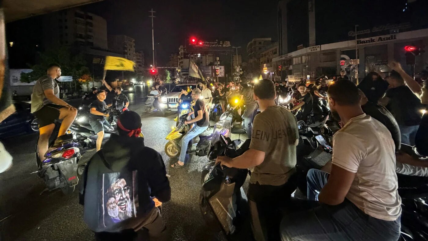 Hezbollah supporters take to the streets in the southern suburbs of Beirut to protest against the trilateral agreement that was signed between the US, Israel and Lebanon on 27 June 2026 (Ibrahim Amro/AFP)