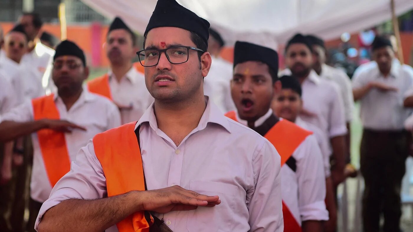 Hindu Rashtriya Swayamsevak Sangh (RSS) volunteers march along a road during an event to mark the Hindu New Year in Allahabad on 2 April 2022 (AFP)