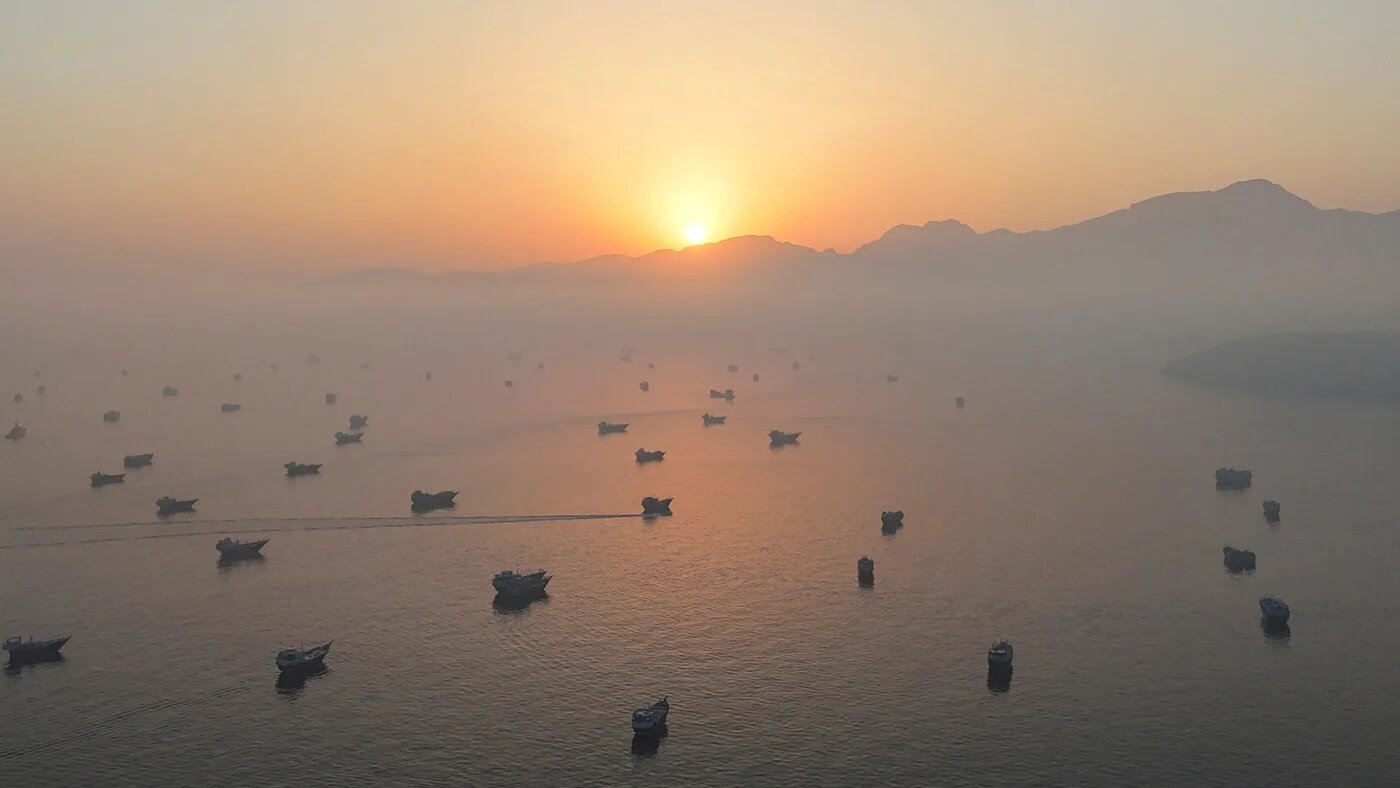 A drone view shows vessels in the Strait of Hormuz, as seen from Musandam, Oman, 15 June 2026 (Reuters)
