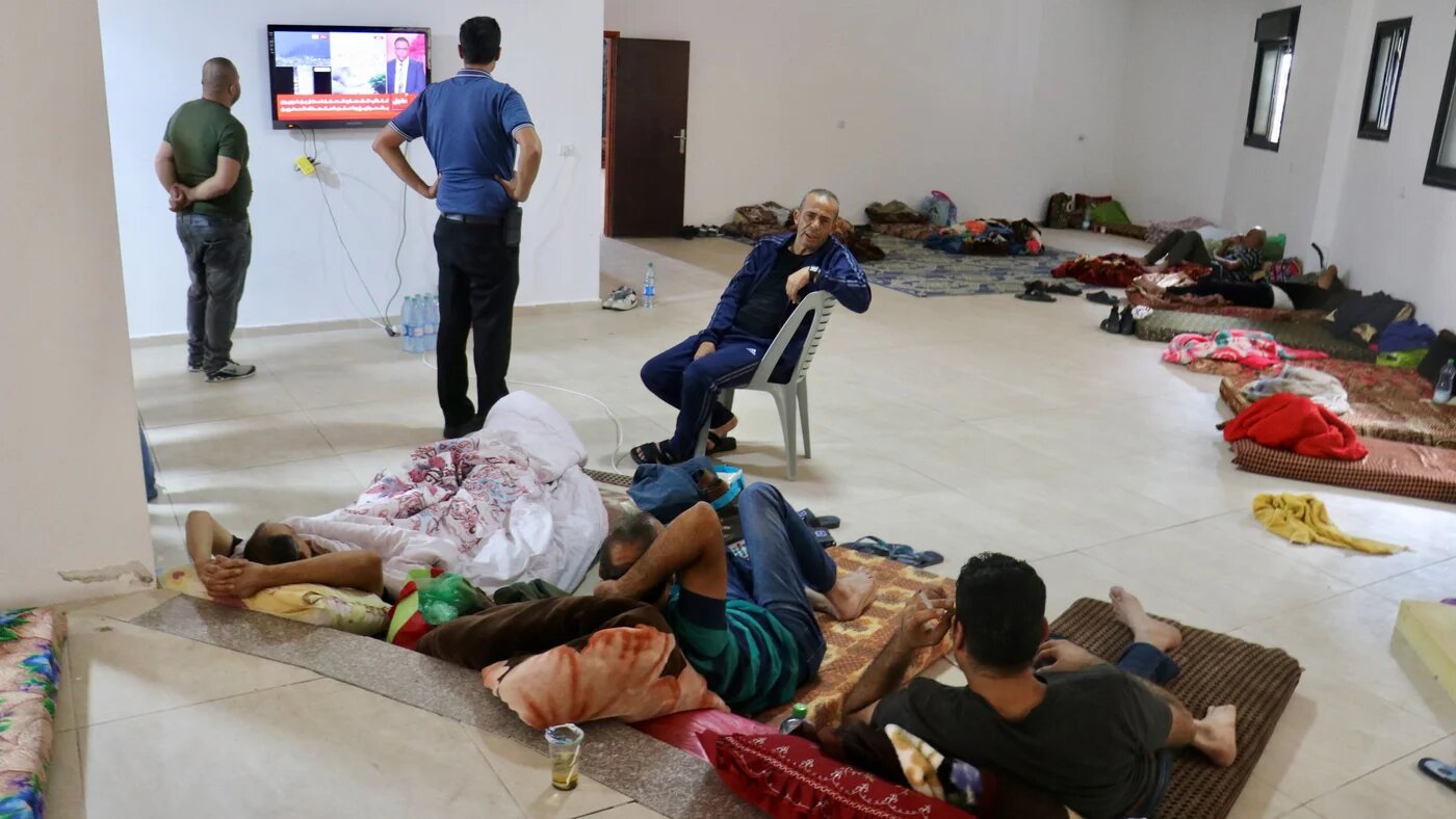 Palestinian workers stranded in Tarkumya in the West Bank after having their work permits revoked (MEE/Misab Shawir)