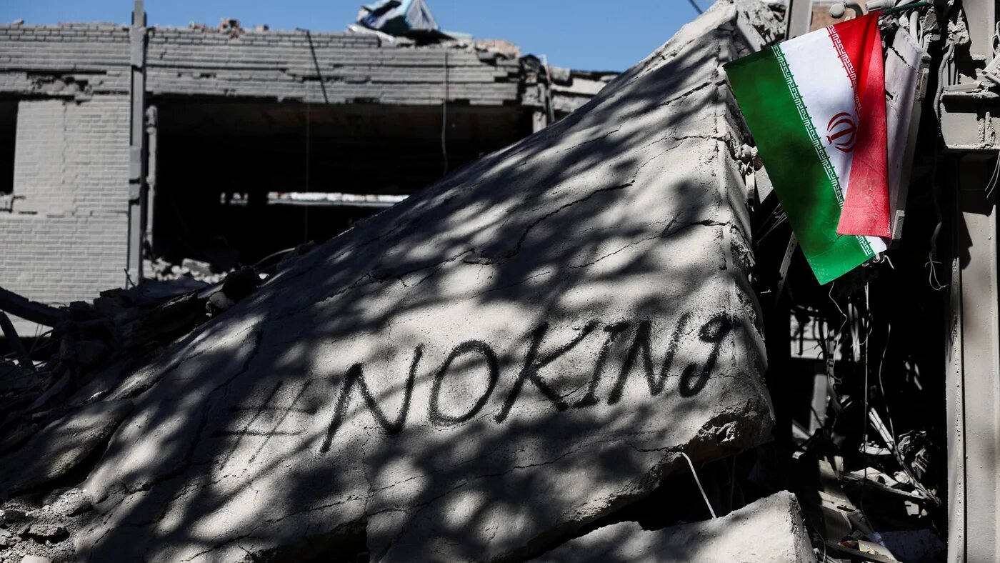 An Iranian flag hangs amidst the rubble of a building of the Sharif University of Technology, which was damaged in a strike, in Tehran, Iran, 7 April 2026 (Majid Asgaripour/WANA via Reuters)
