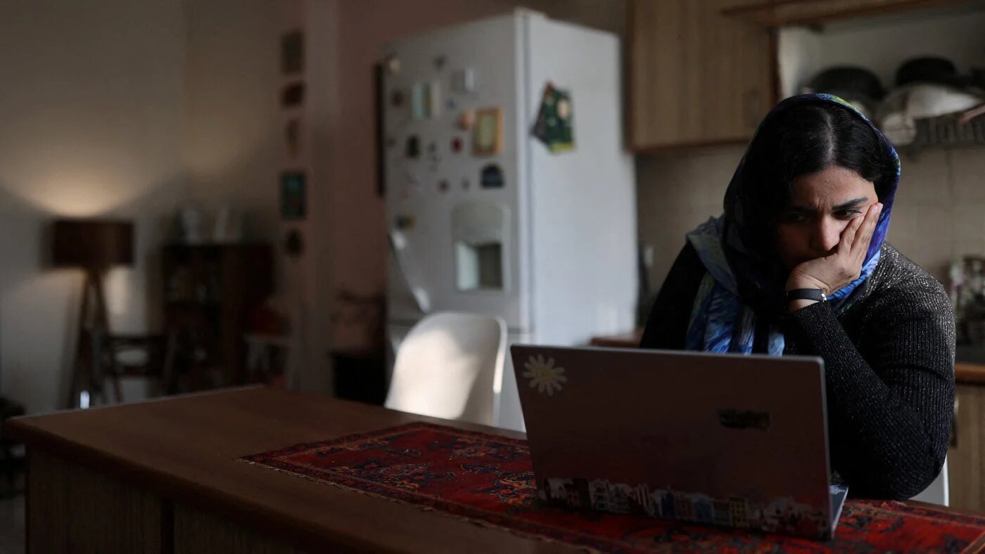 An online teacher works on her laptop at home, after a nationwide internet shutdown in Tehran, Iran, 24 January 2026 (Majid Asgaripour/WANA via Reuters)