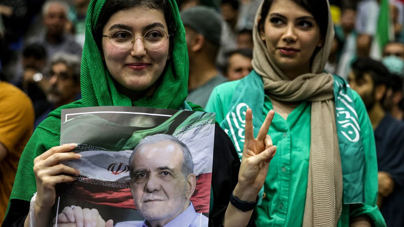 Women attend a campaign rally for reformist candidate Massoud Pezeshkian at Afrasiabi Stadium in Tehran on 23 June (Atta Kenare/AFP)