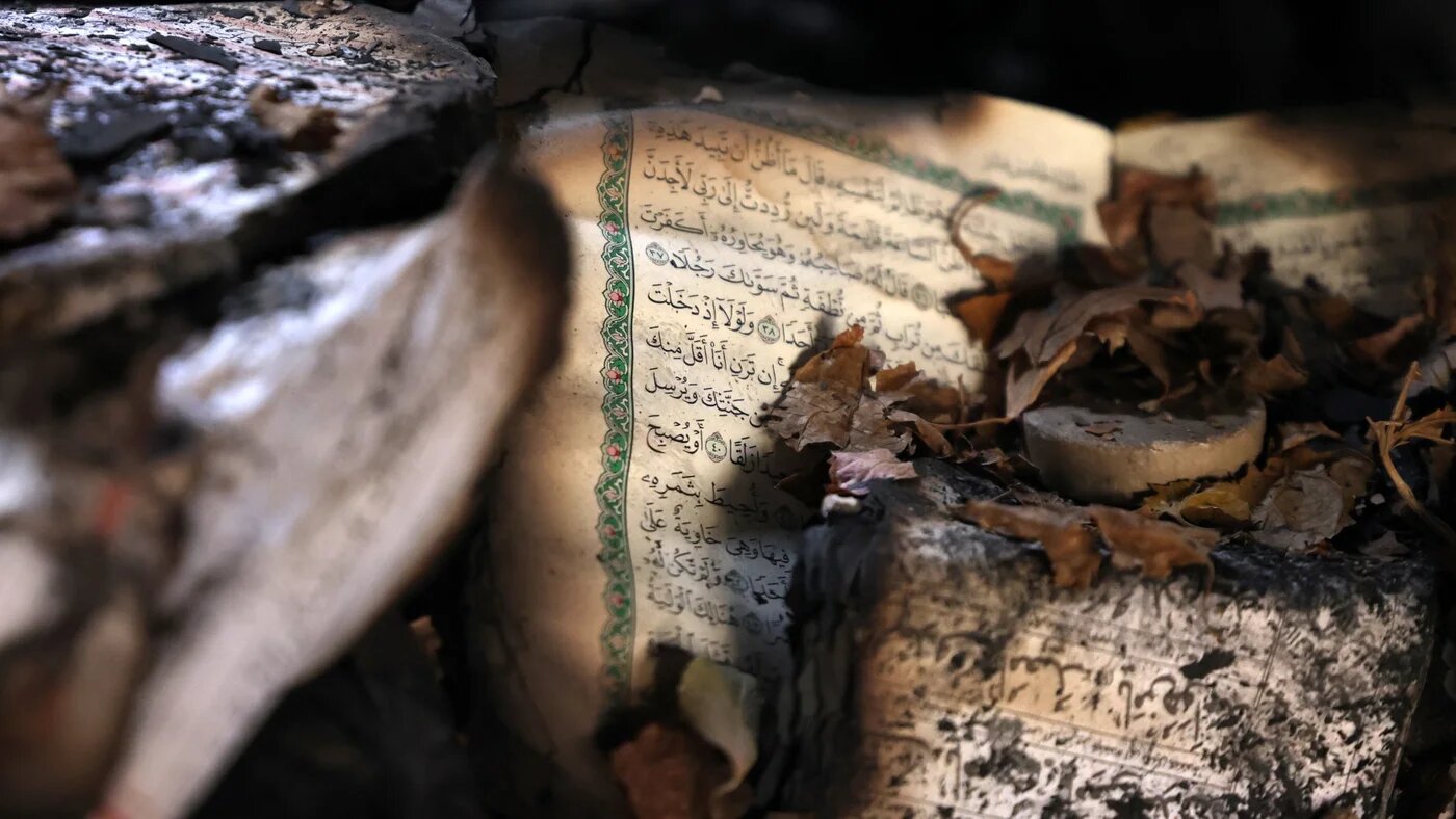 Burnt religious books inside the Beheshti Mosque that was damaged during recent public protests, in Tehran on 21 January 2026 (Atta Kenare/AFP)