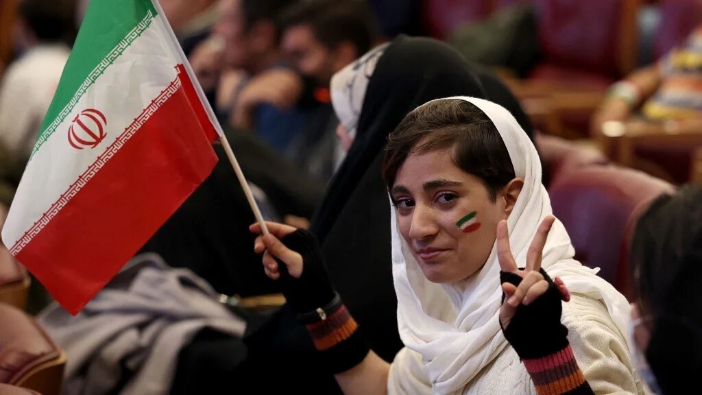 Iranian fans watch the match between their national football team and the USA during the Qatar 2022 World Cup, on a giant screen at Milad Tower in the capital Tehran, on 29 November 2022 (AFP)